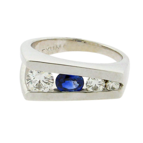 oval sapphire with three round diamonds set in 14 k white gold 