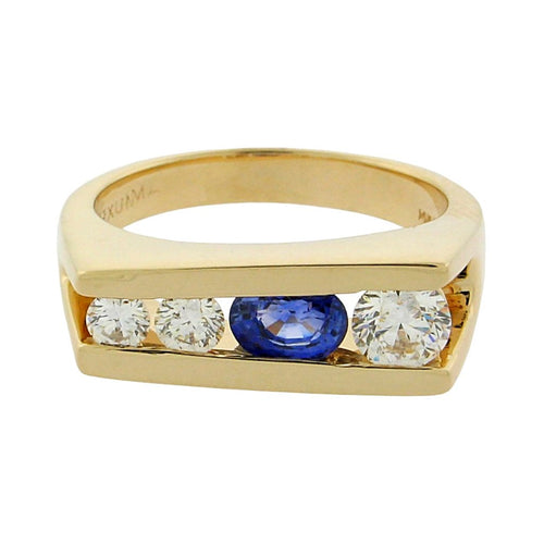 .69 ct oval sapphire  .46 ct total weight round diamonds  14 k yellow gold ring