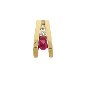 oval ruby with three round diamonds set in a 14 kt yellow gold V shaped pendant
