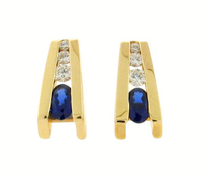 oval sapphires  .21 ct total weight diamonds  14 k yellow gold studs 