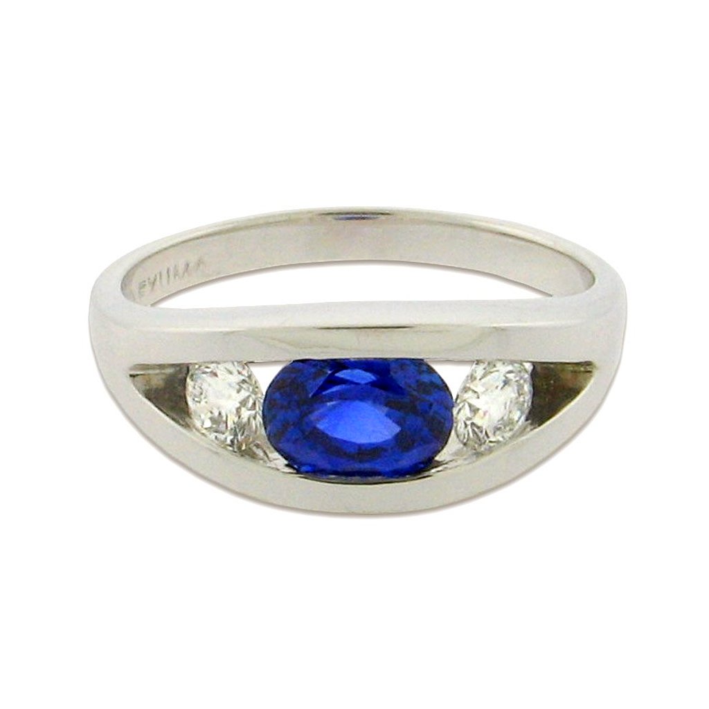 1.98 ct oval-cut brilliant sapphire  .64 ct total weight round diamonds  14 k white gold ring