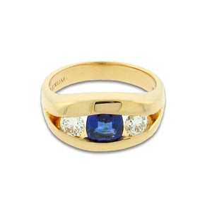 1.21 ct cushion cut sapphire  .60 ct total weight round diamonds  14 k yellow gold ring